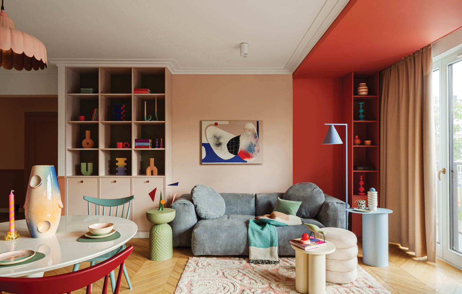 living area with grey couch and colorful furnishings