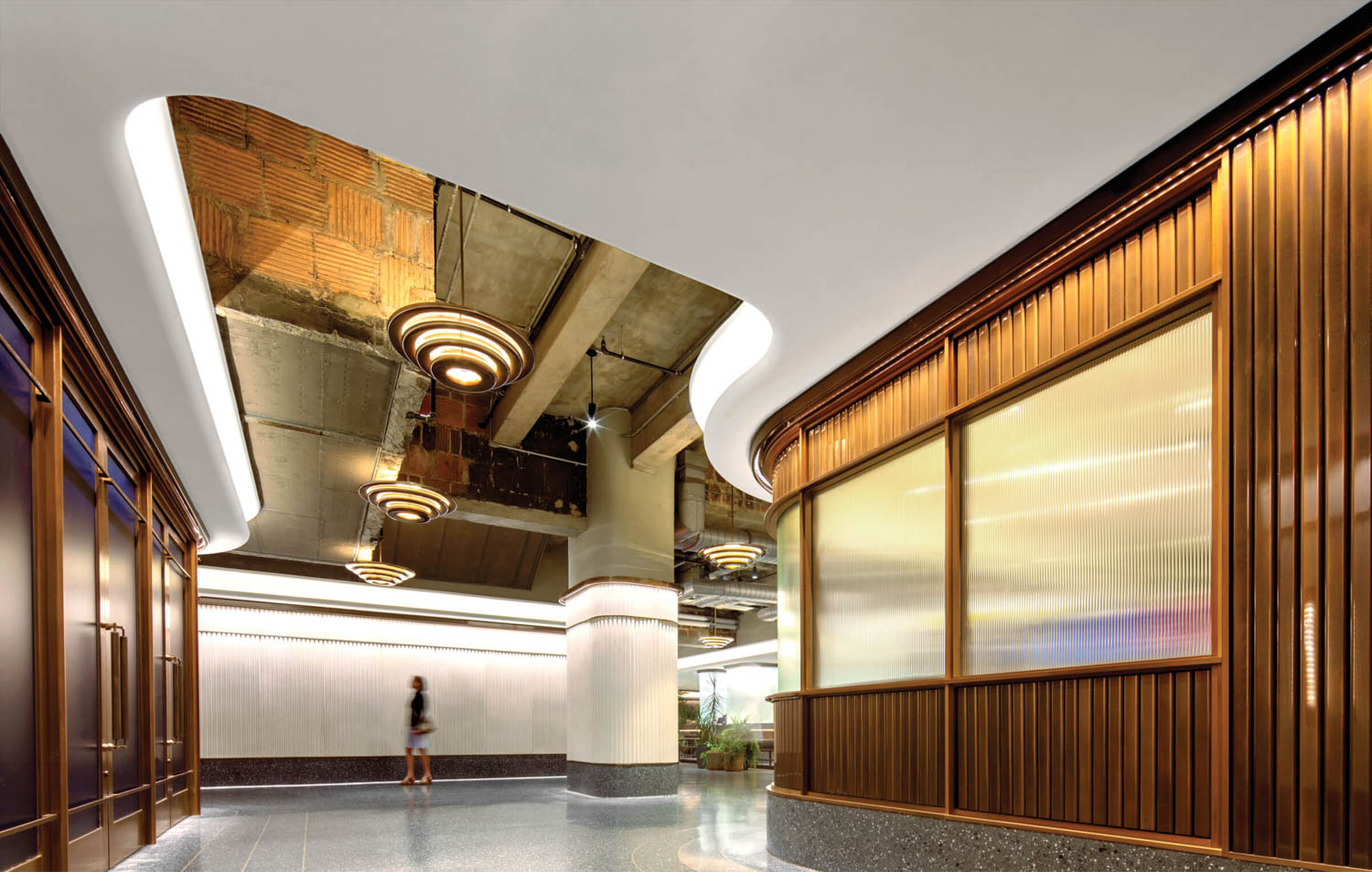 lobby with lots of bright lights and wooden columns