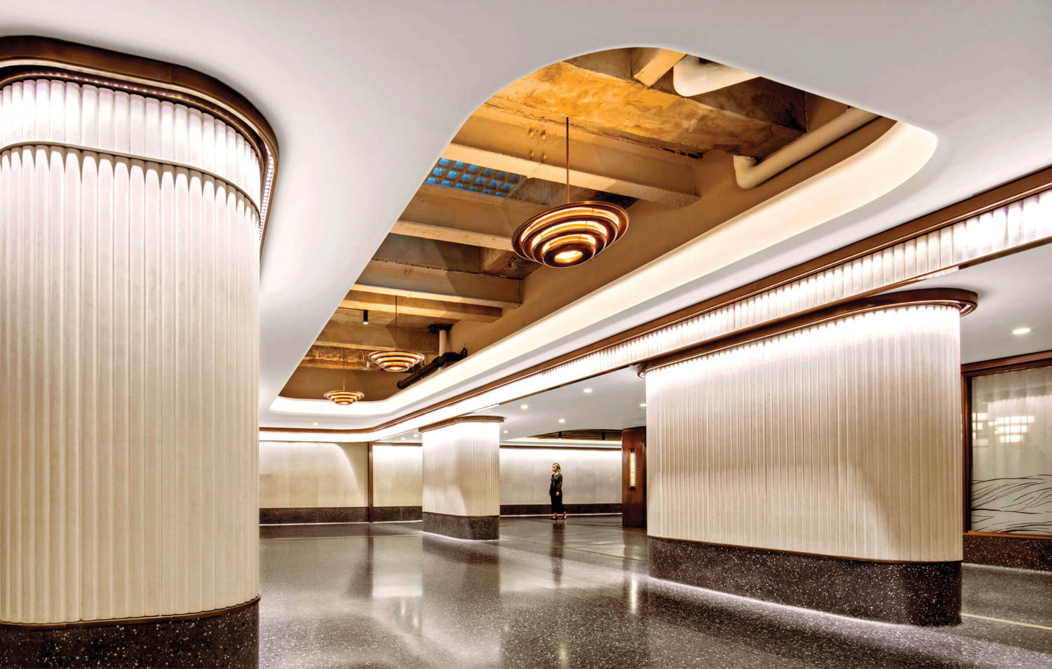 hallway area with high ceilings and bright lights