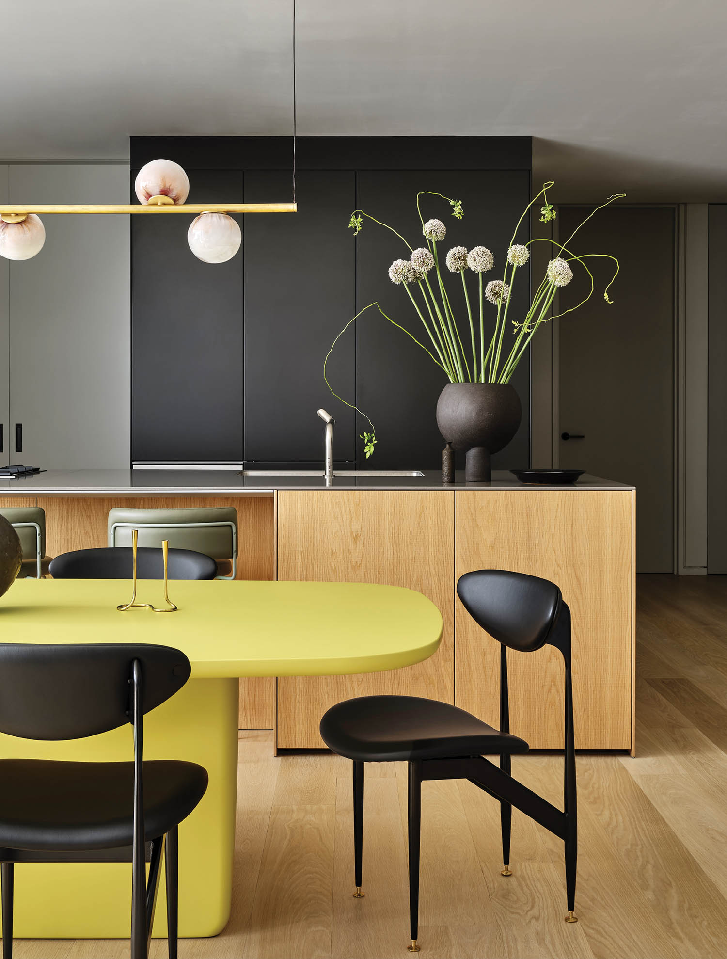 dining area with yellow table and view to the kitchen