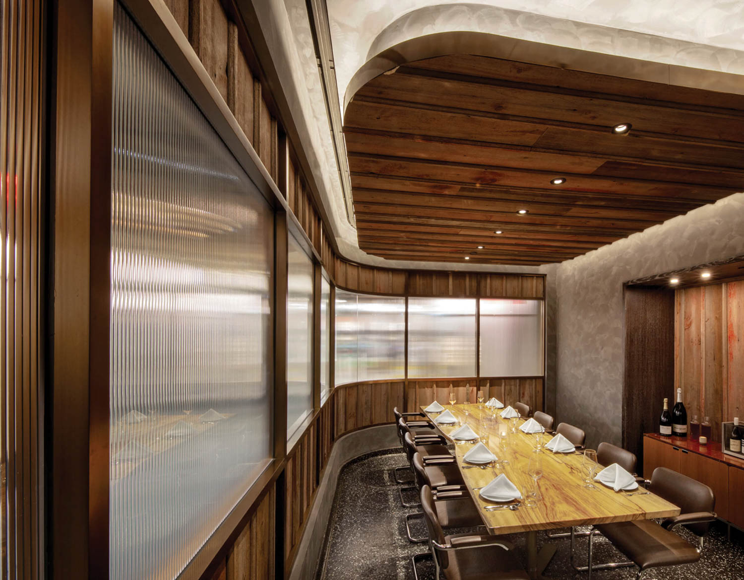 private dining room with wooden paneled ceiling and long table