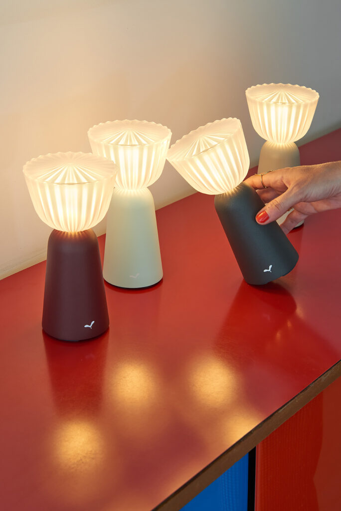 multiple small lamps on red table