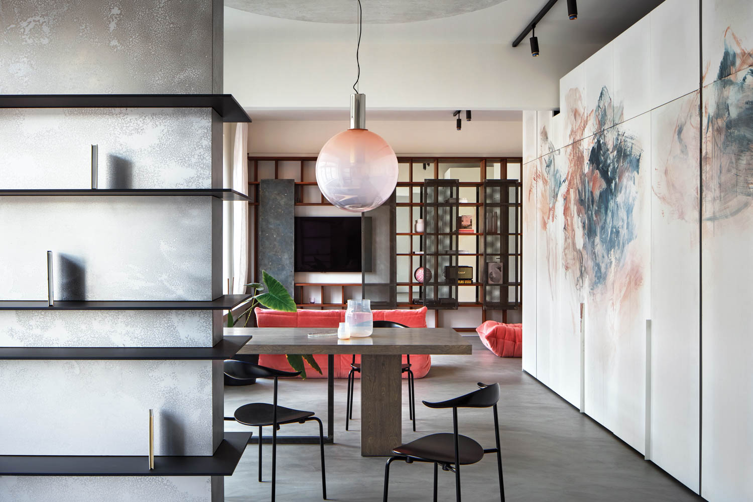 dining area with marble walls and orb light