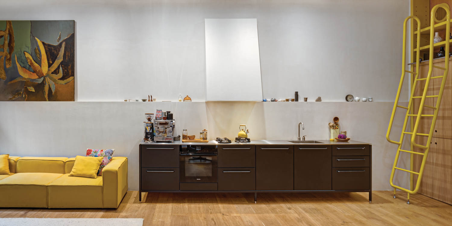 living area with brown console and yellow sofa and ladder