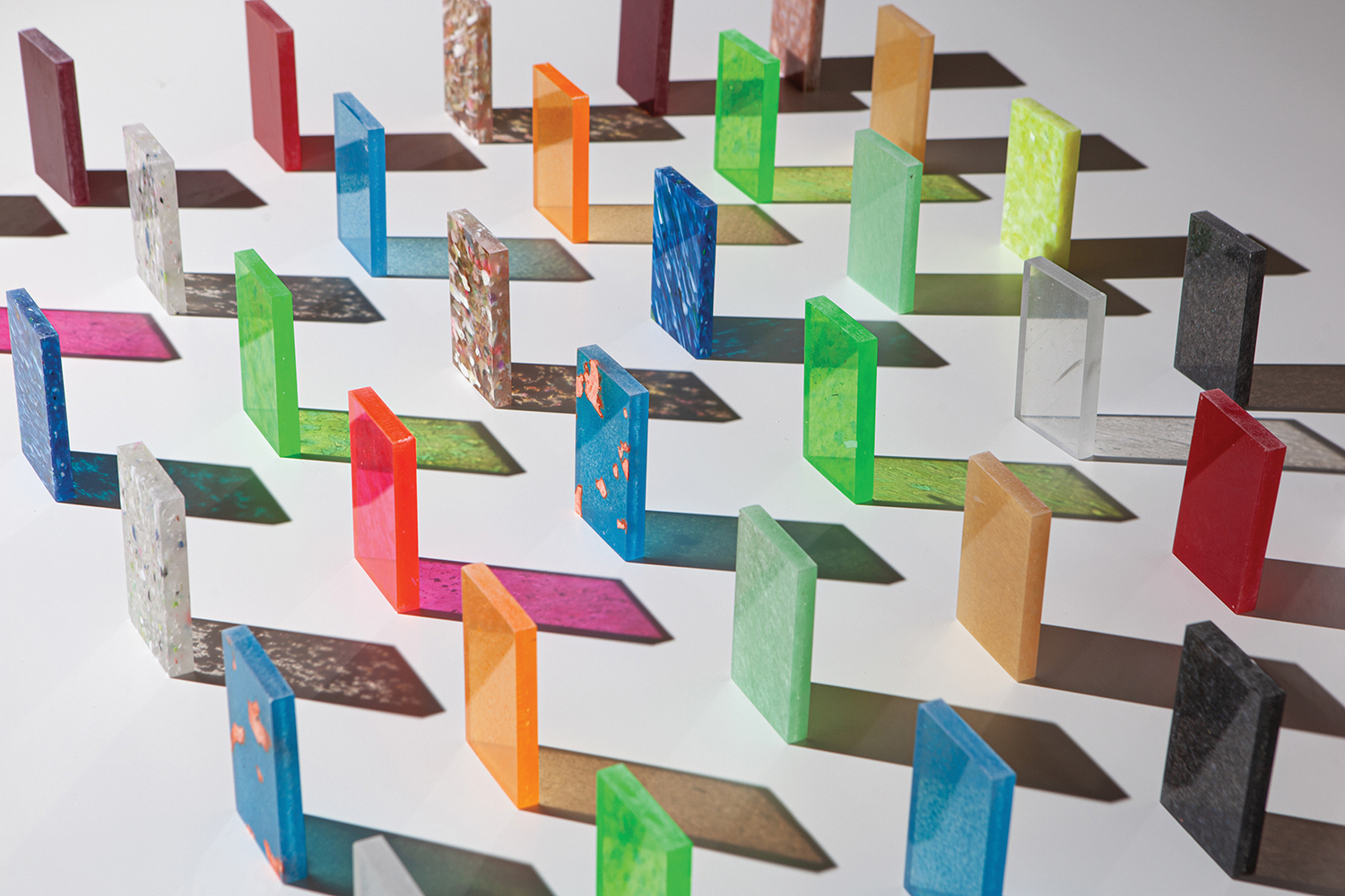 A group of colorful colored blocks on a white surface