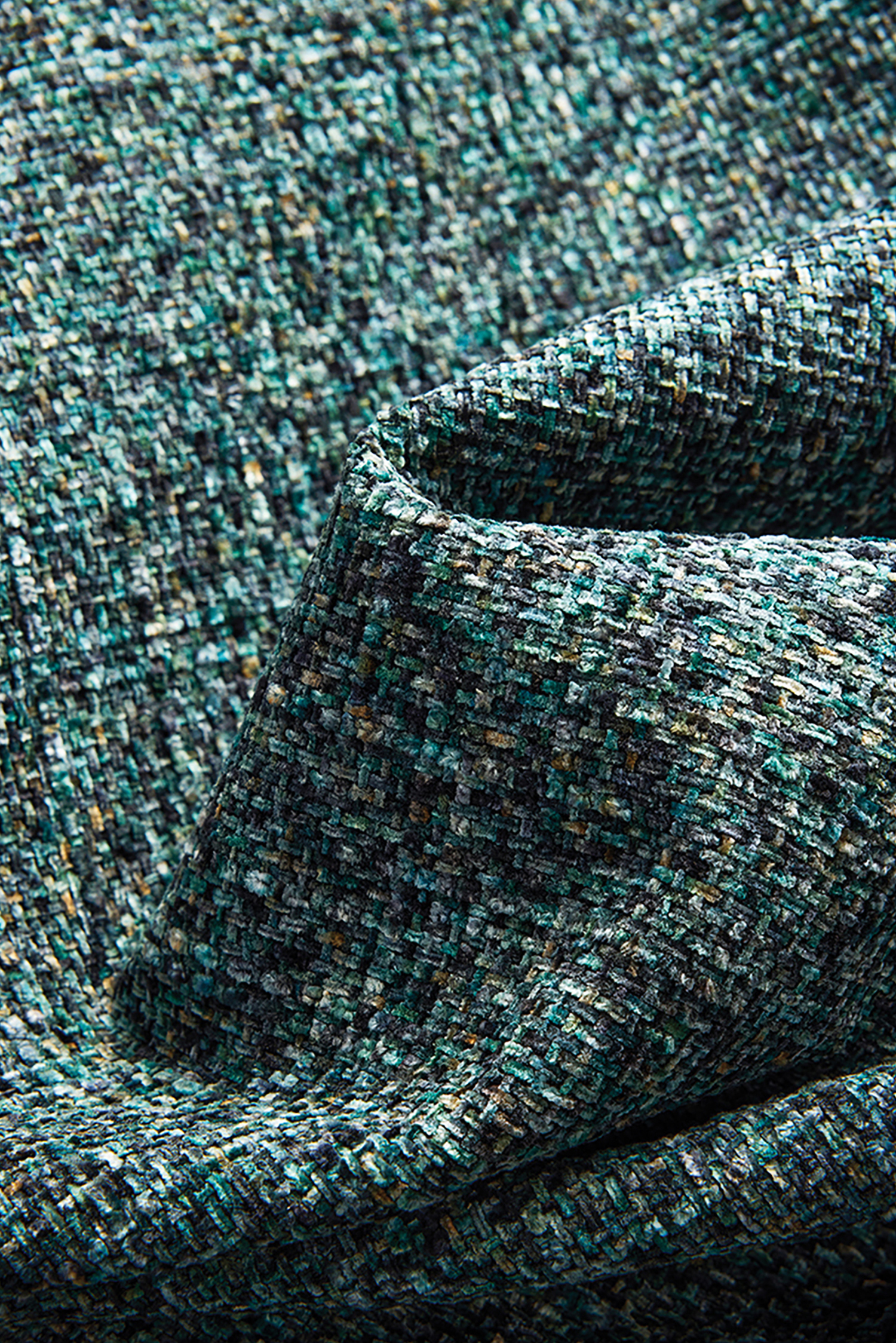 a close up of a blue and green tweed fabric