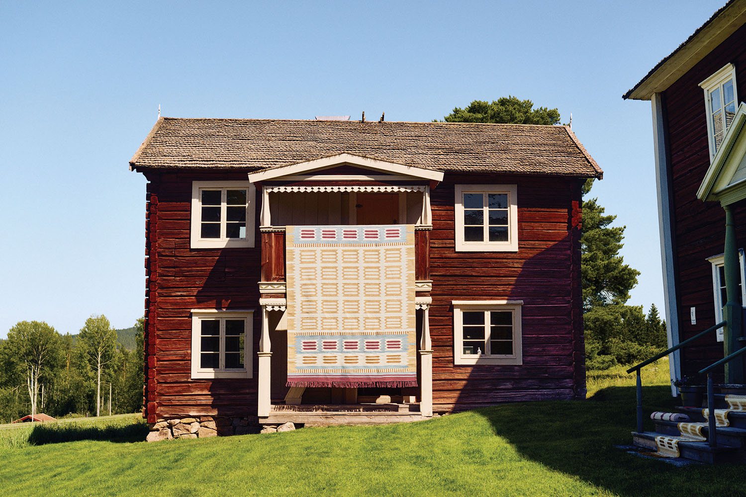 a house with a red siding on the side