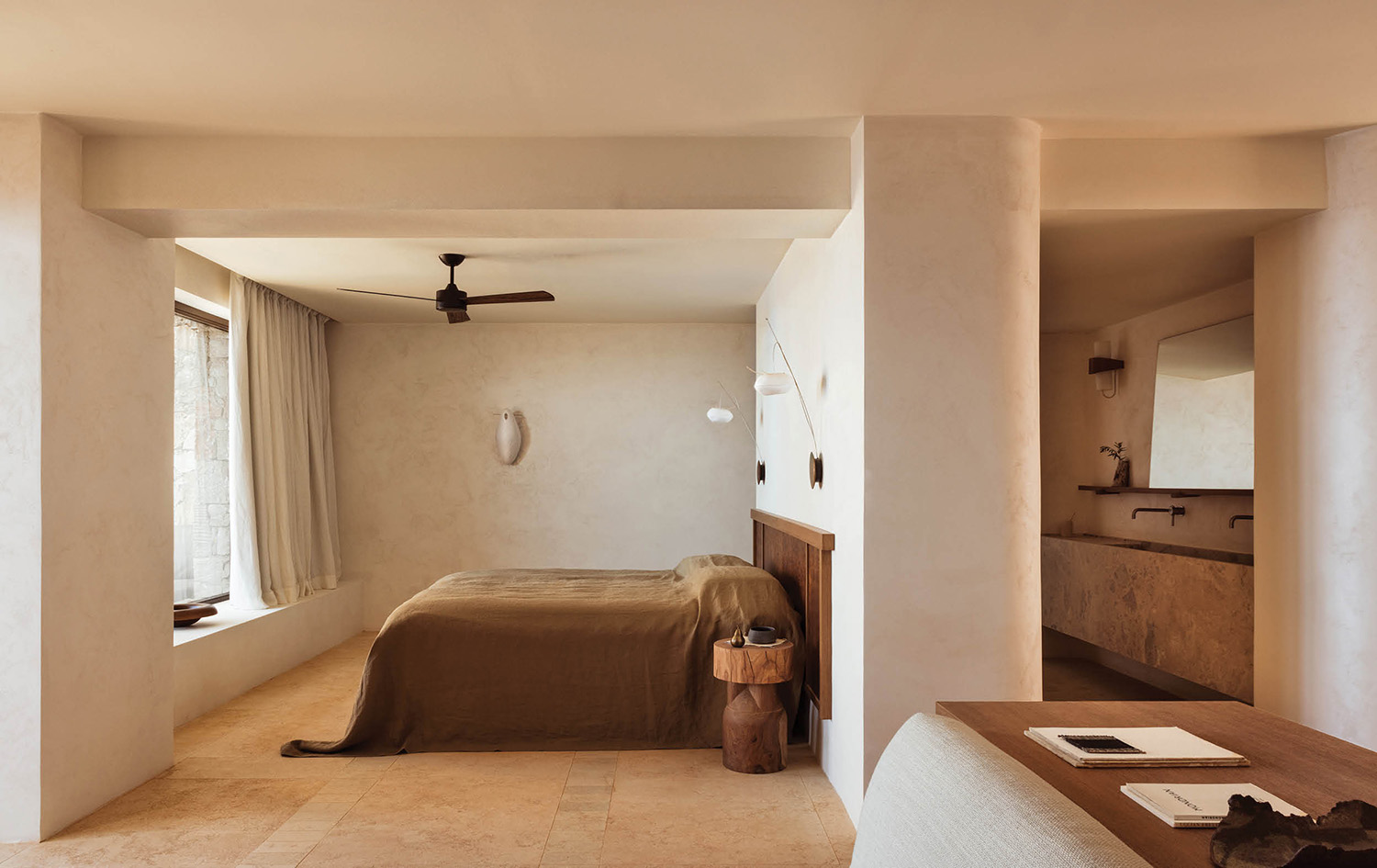 a bedroom with a bed and a desk