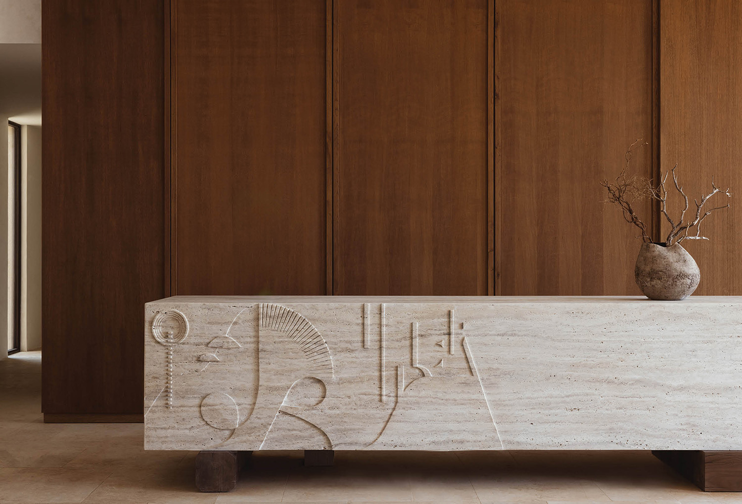 a vase sitting on top of a wooden table