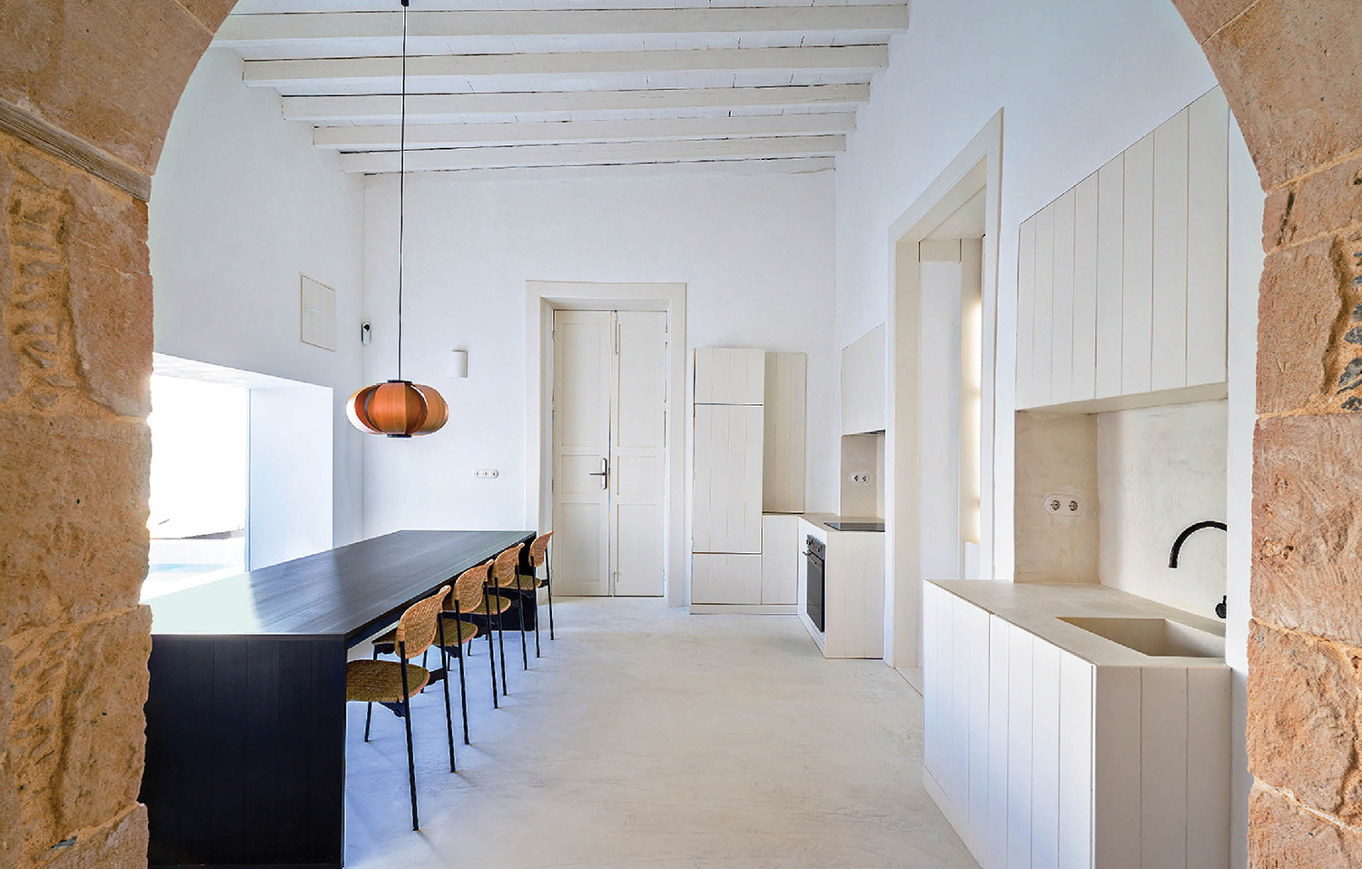 a kitchen with a sink and a table