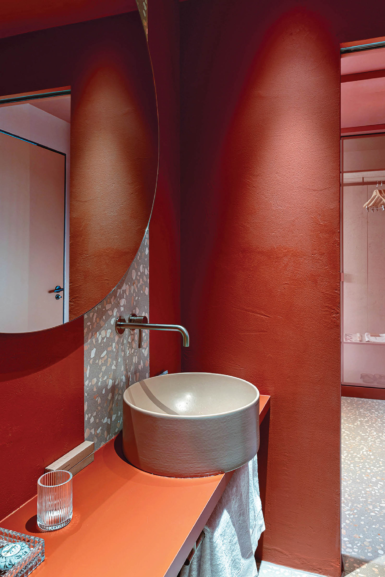A bathroom with a sink and a mirror
