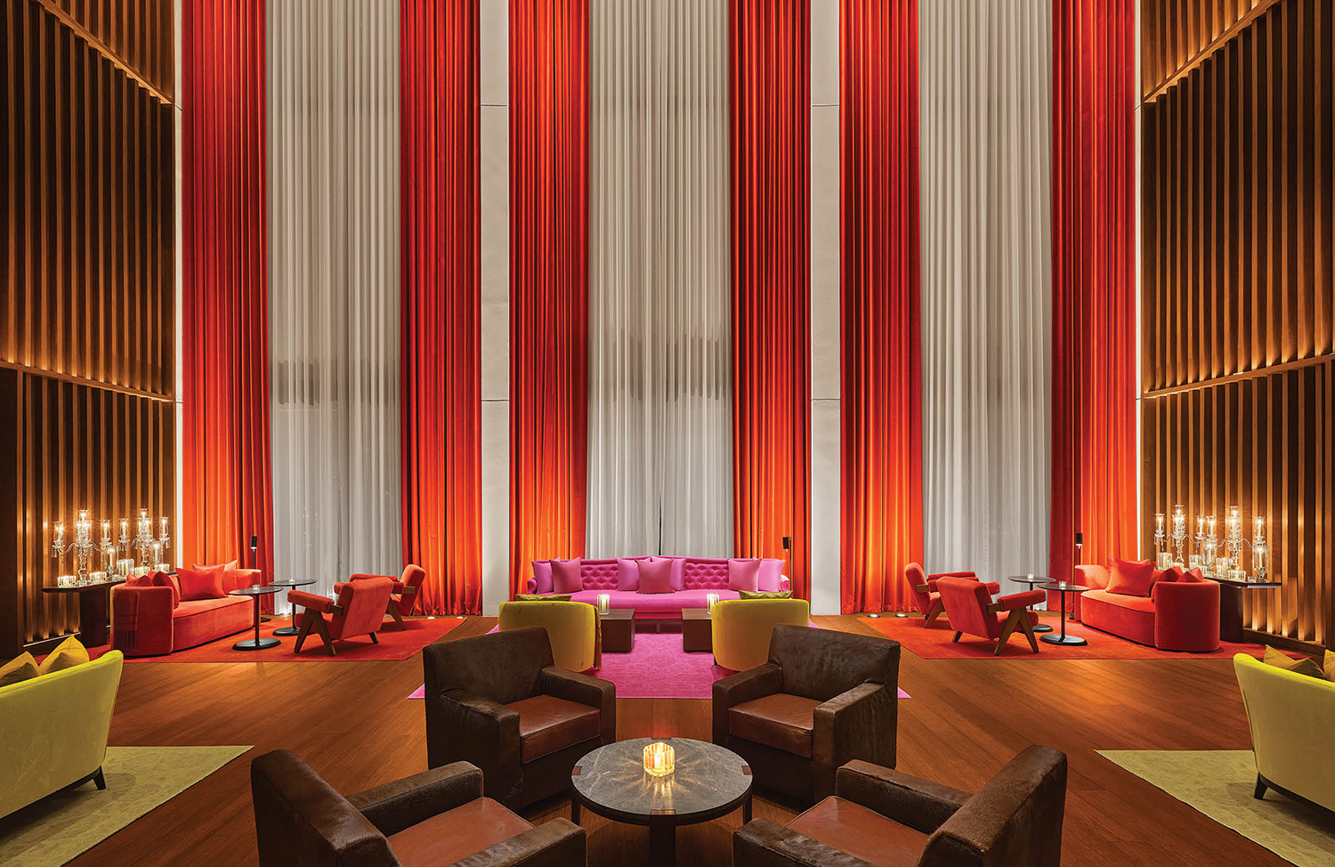 The lobby at the hotel is decorated with red and yellow curtains