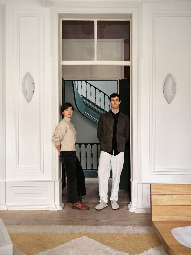 A man and woman standing in a doorway