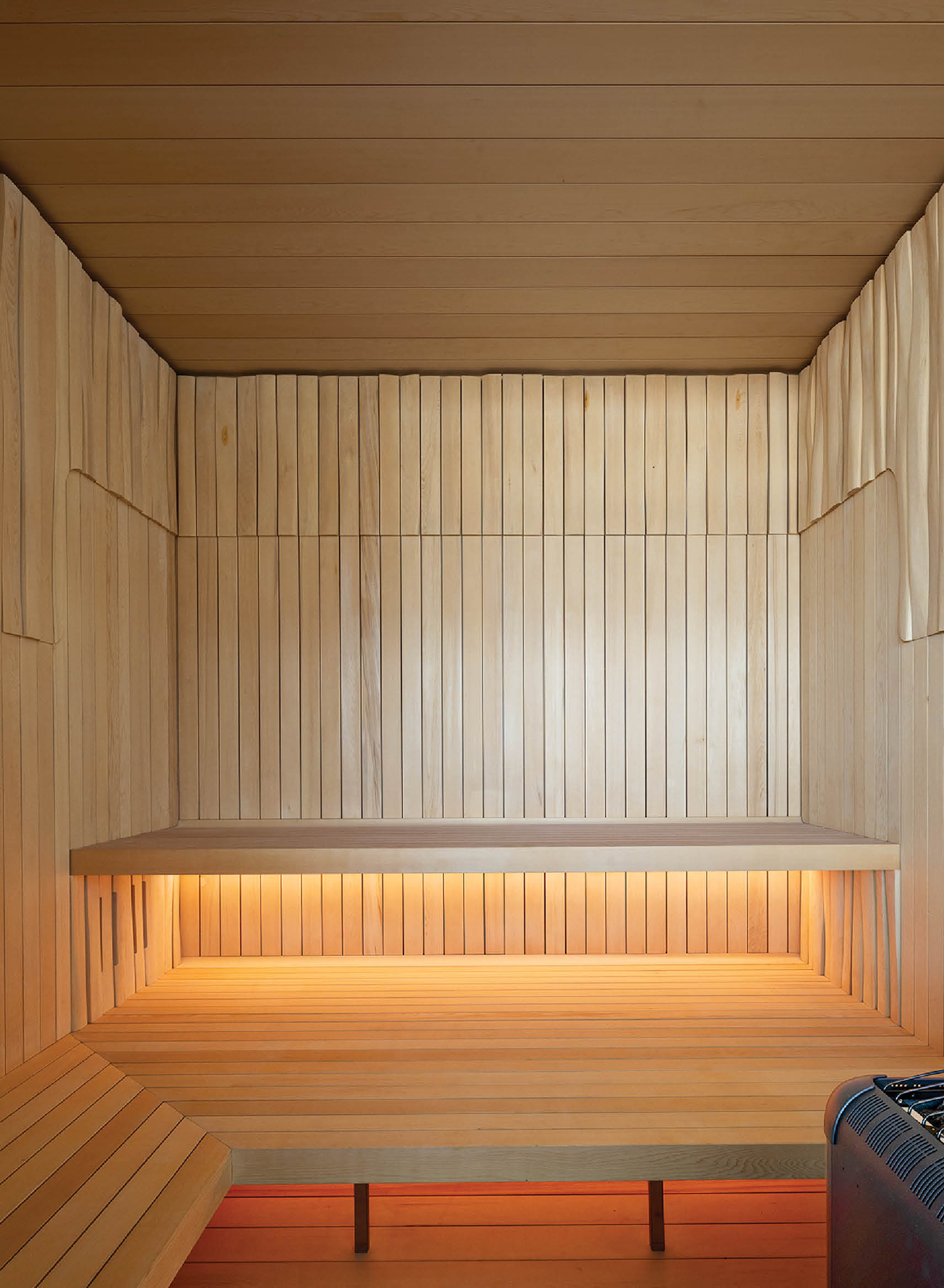 sauna that is paneled in natural cedar