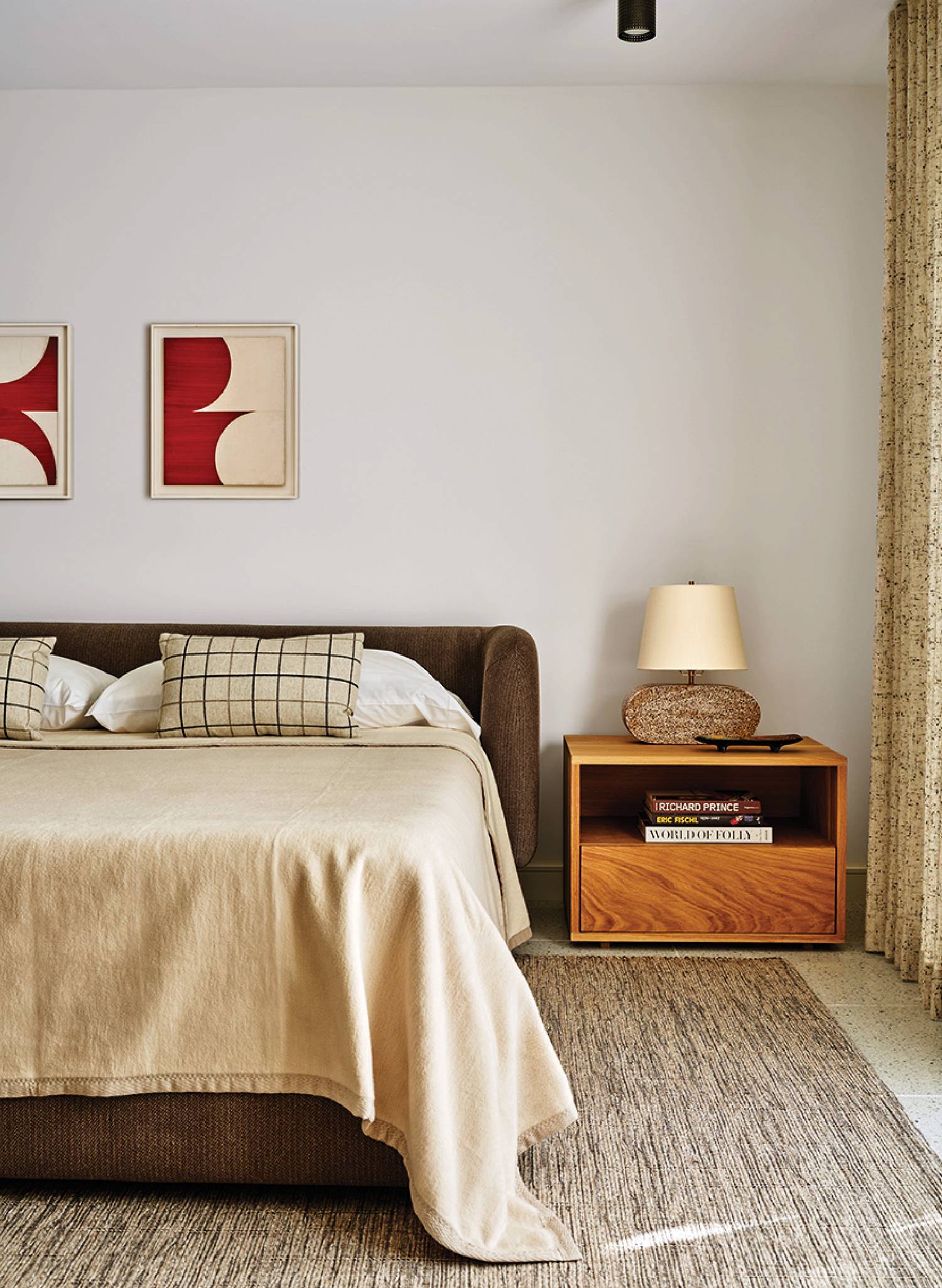A bedroom with a bed and a nightstand