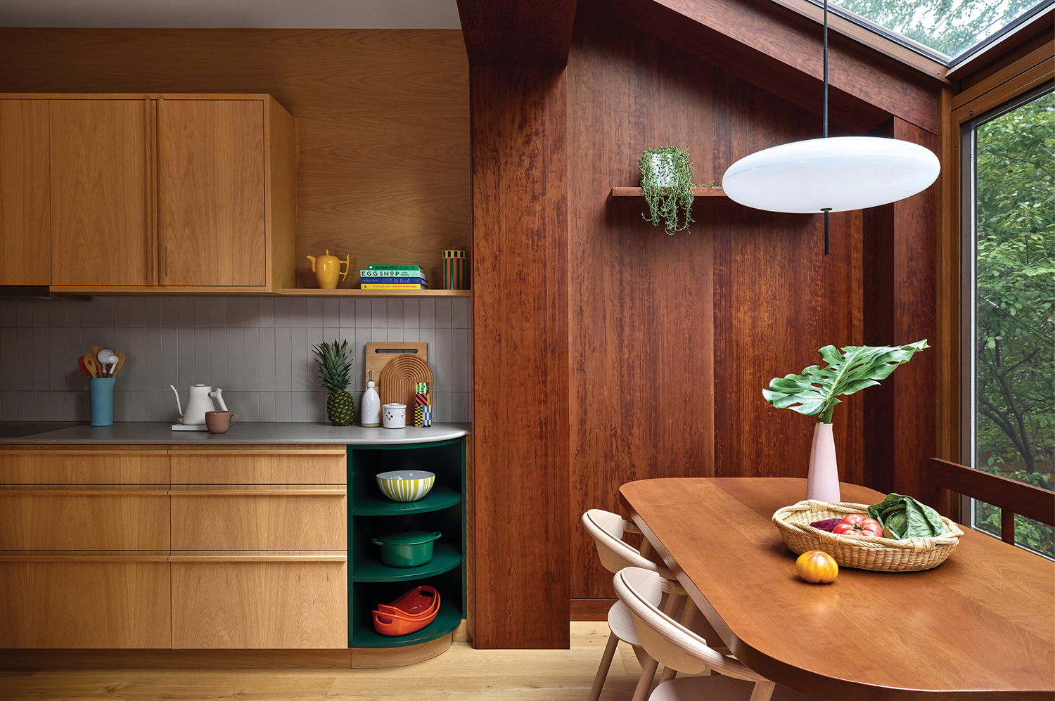 A kitchen with a table and a window