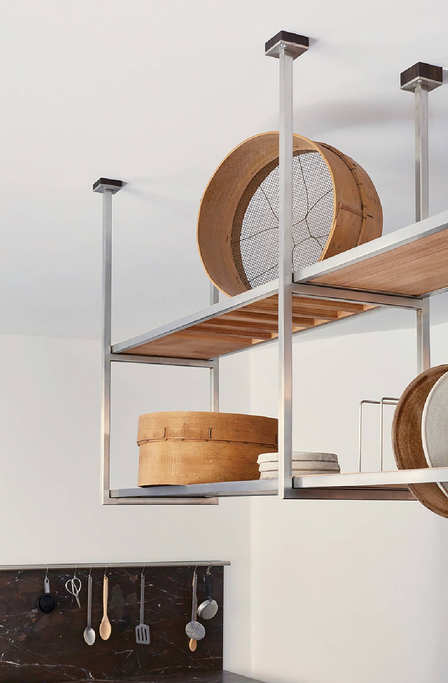 a kitchen with a wooden shelf and a wooden bowl