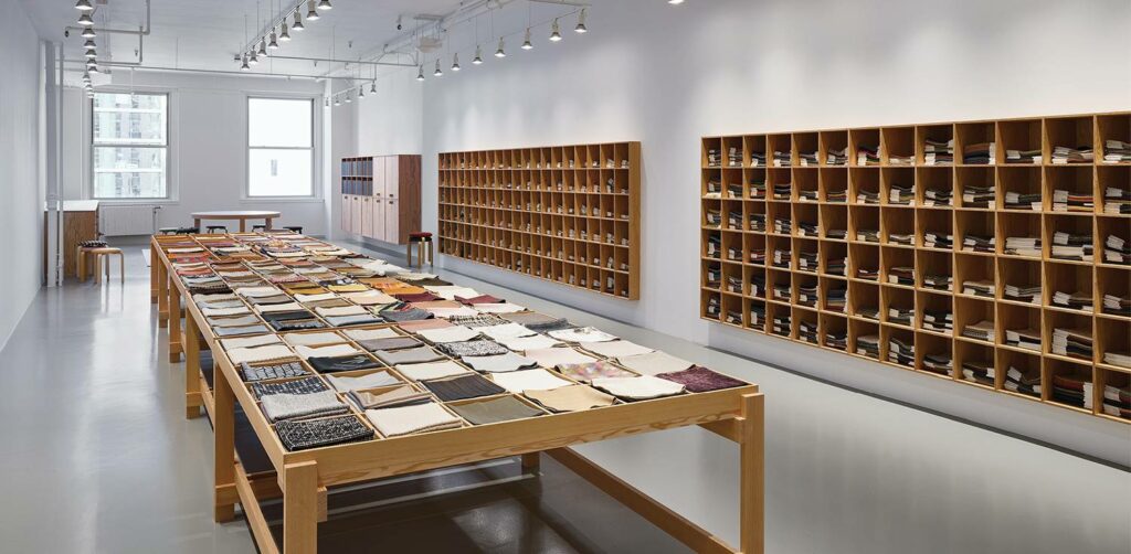 the interior of a room with shelves and shelves filled with book