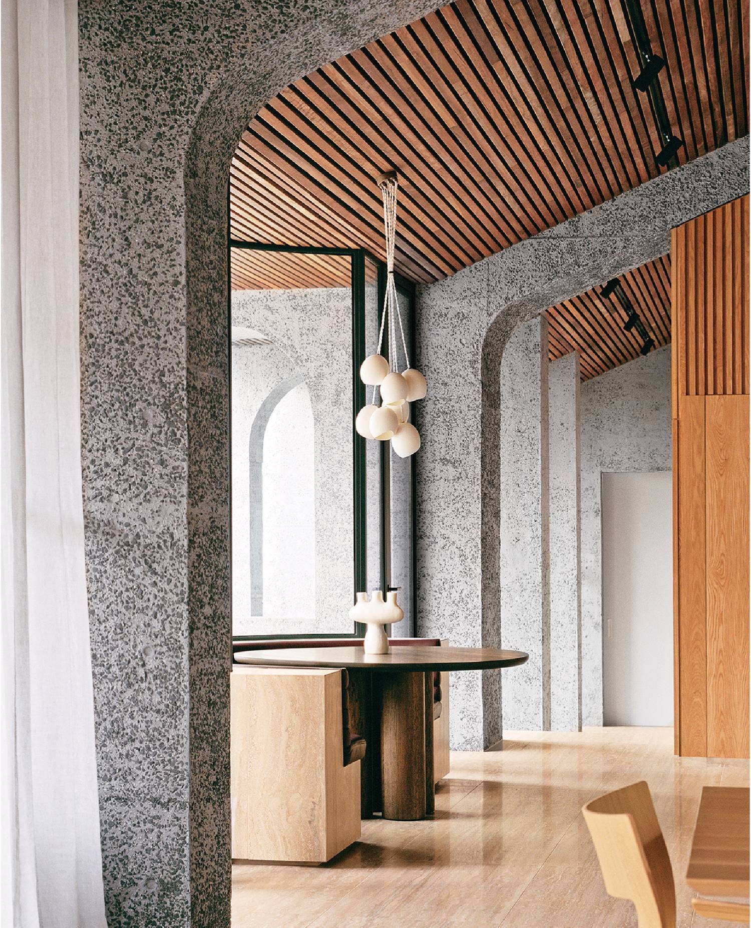 A wooden table and chairs in a room