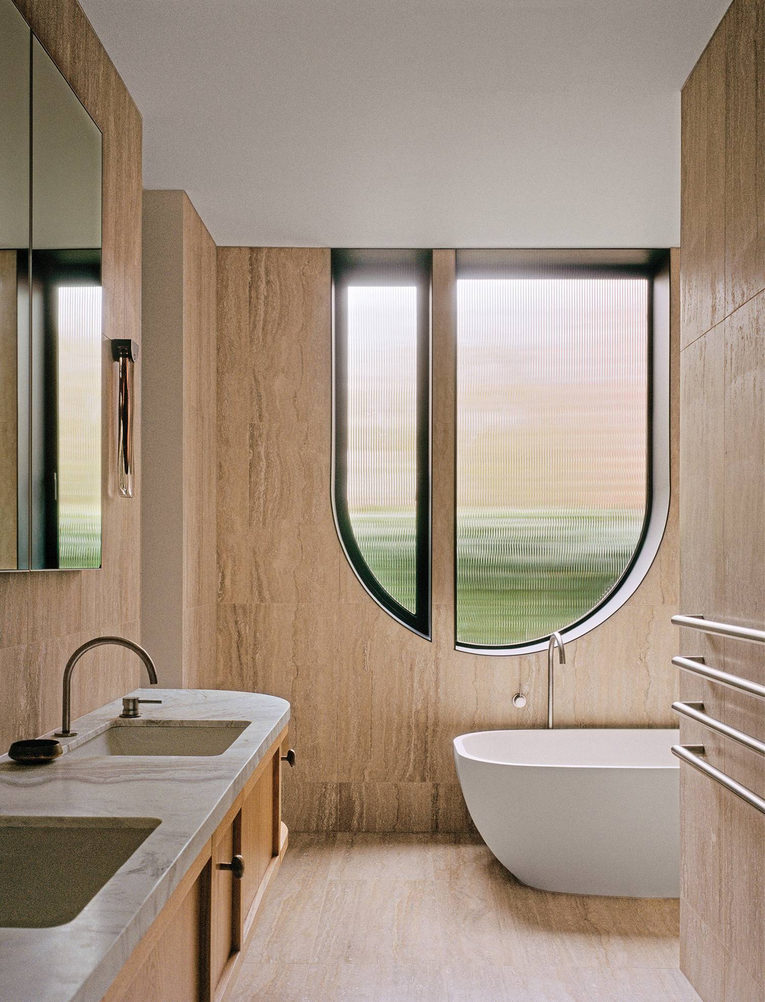 A bathroom with a large tub and a large window