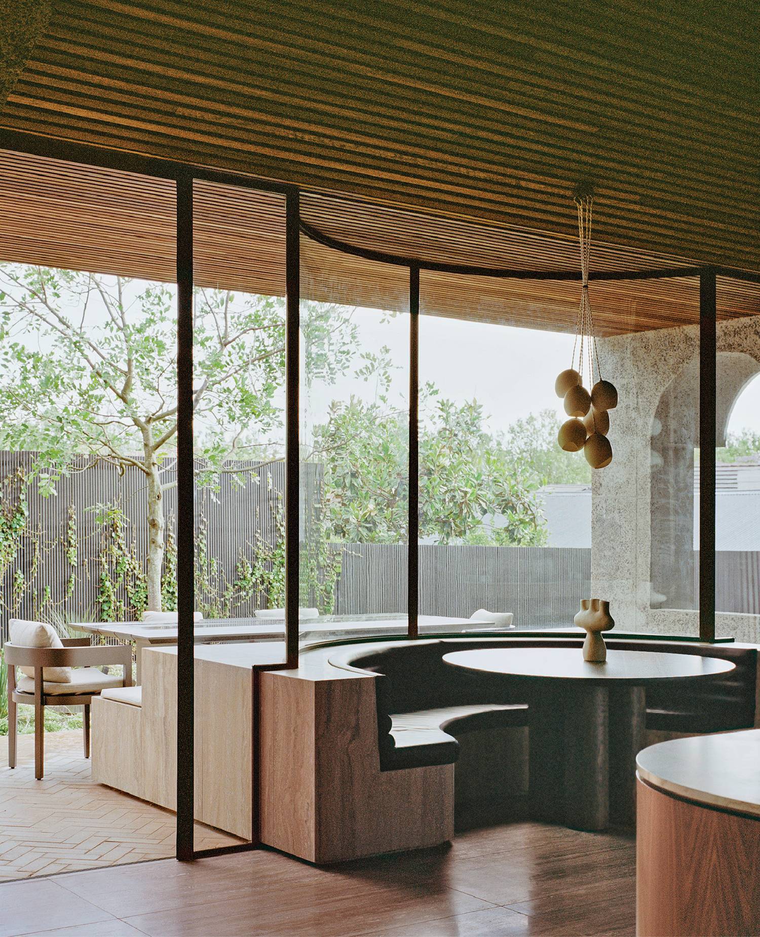 A kitchen with a table and chairs in it