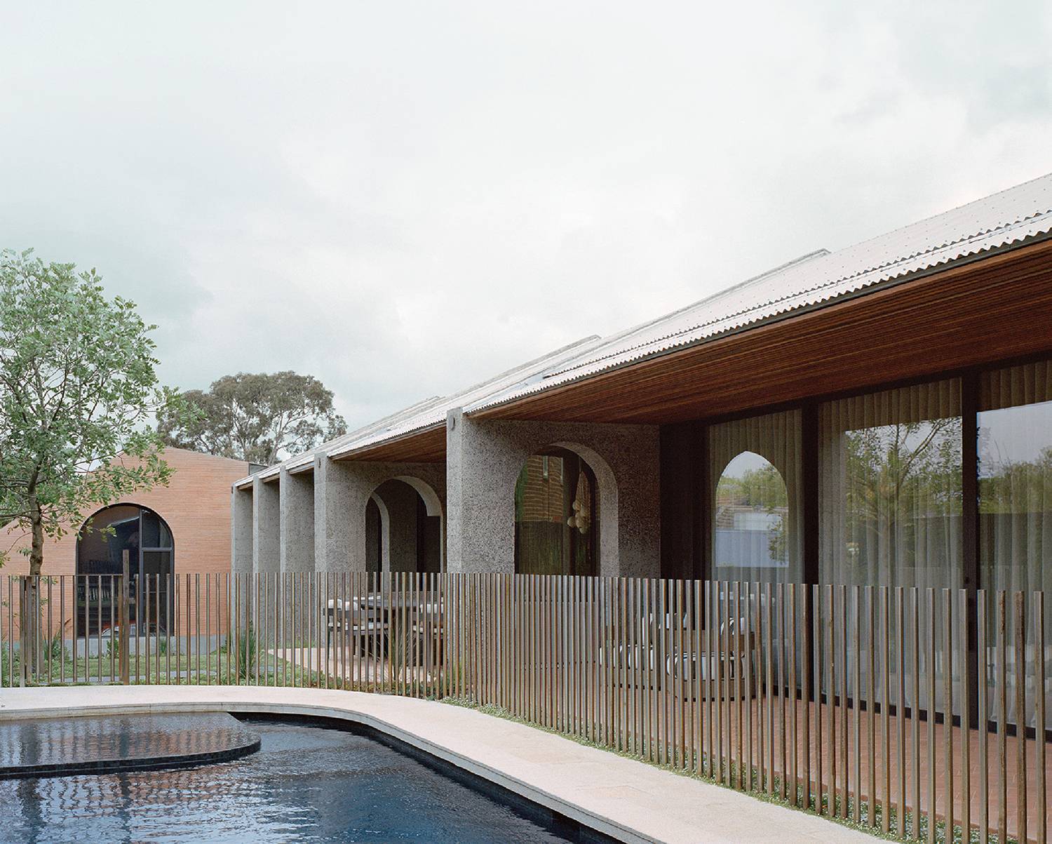 A pool with a wooden fence around it