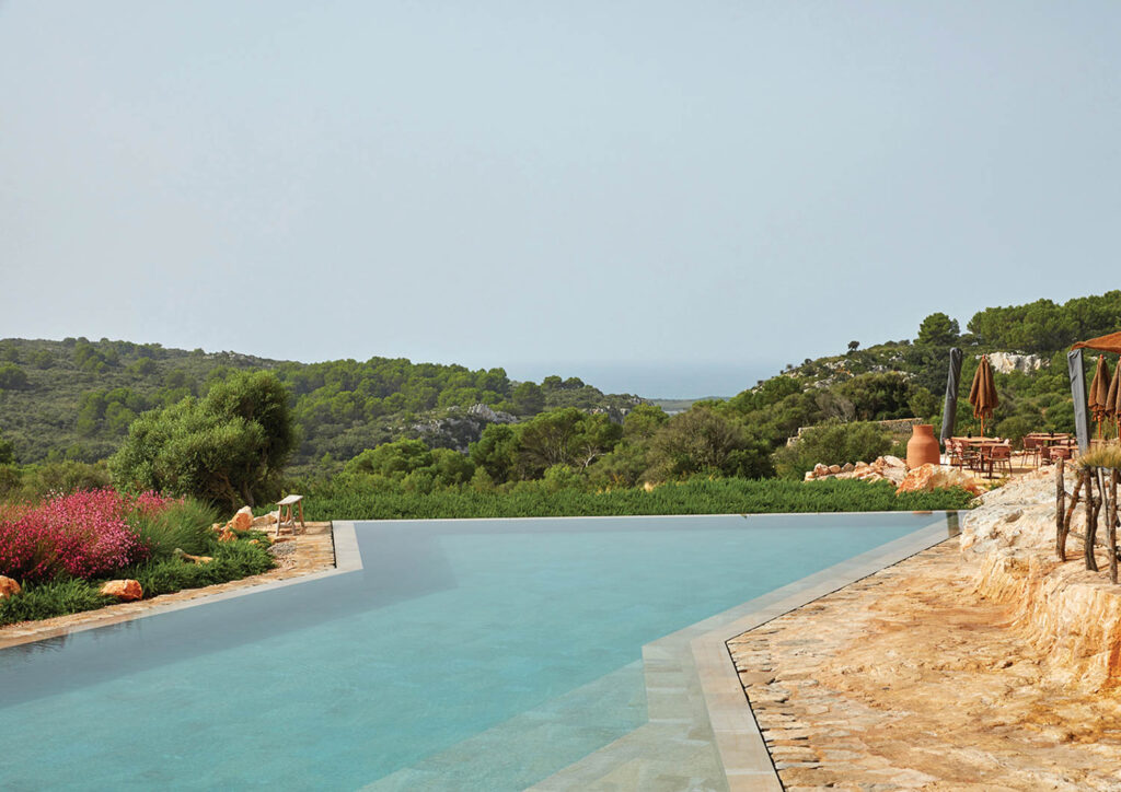 The swimming pool’s irregular shape was carved right into the island’s limestone.