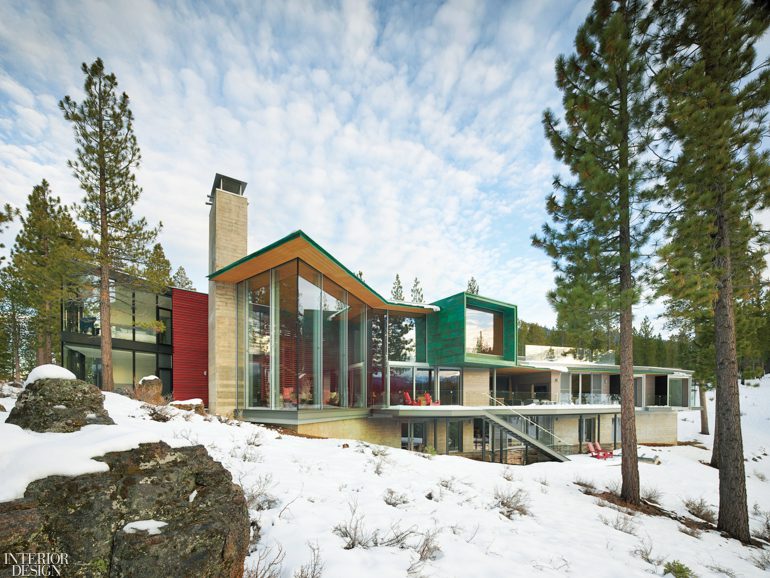 exterior of Truckee ski home with glass windows and surrounded by snow