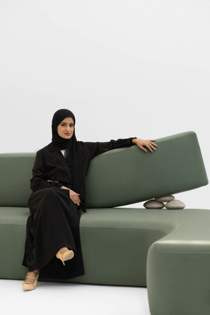 Aljoud Lootah sitting on a green couch