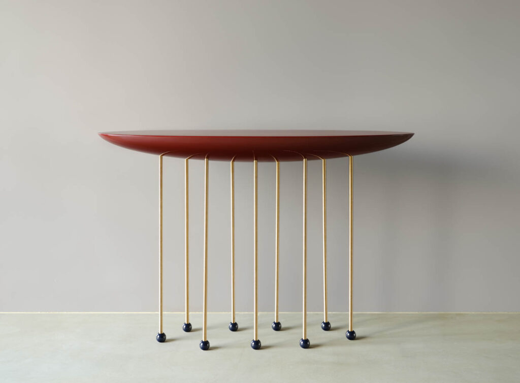 a wood console with thing legs