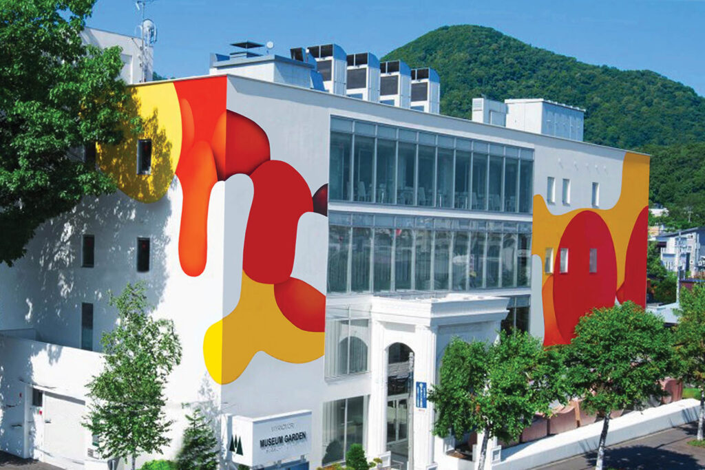 facade of a white building with red and orange paint drips