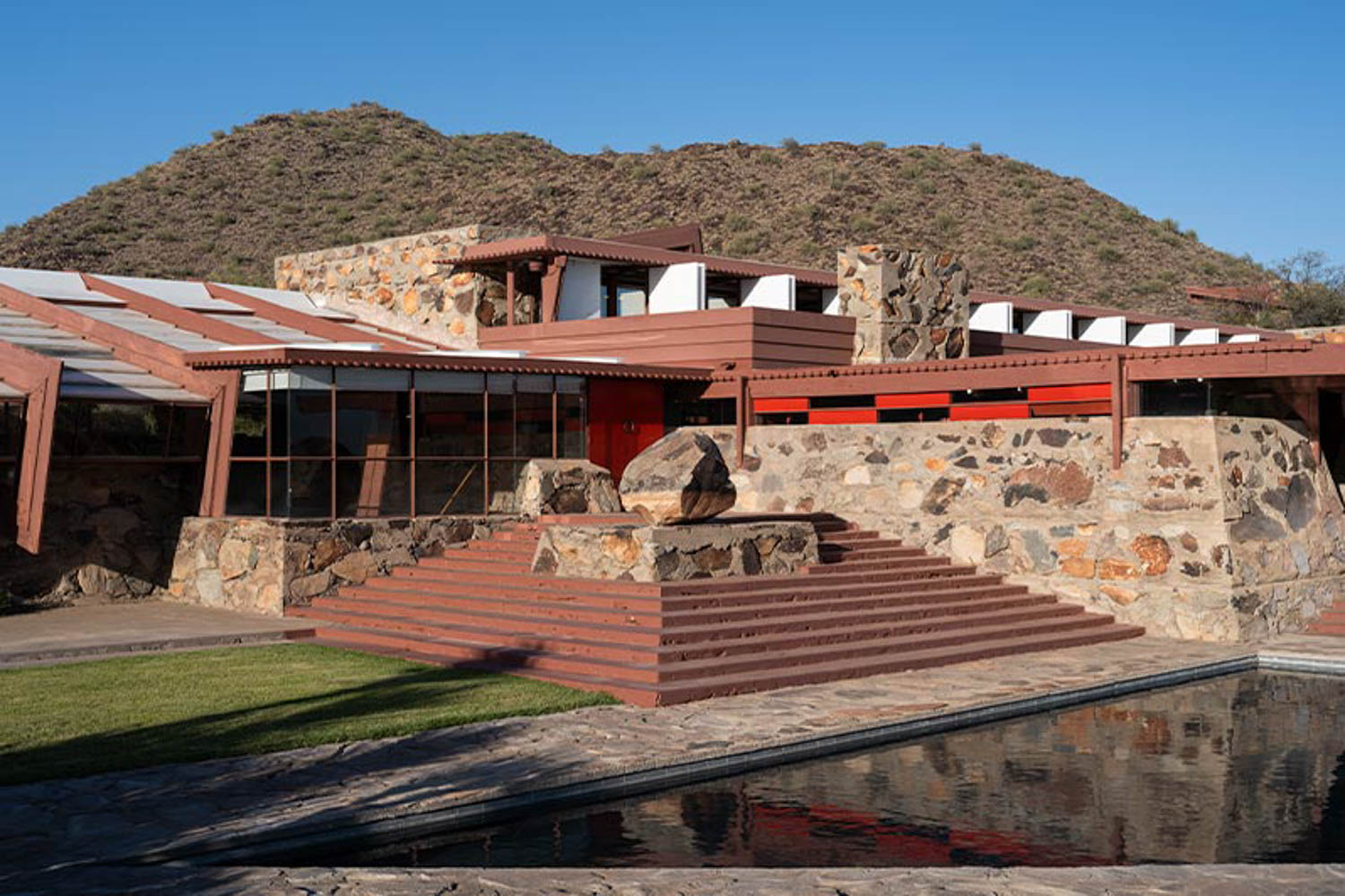 Backdropped by the McDowell Mountains, Taliesin West has a reflecting pool on site.