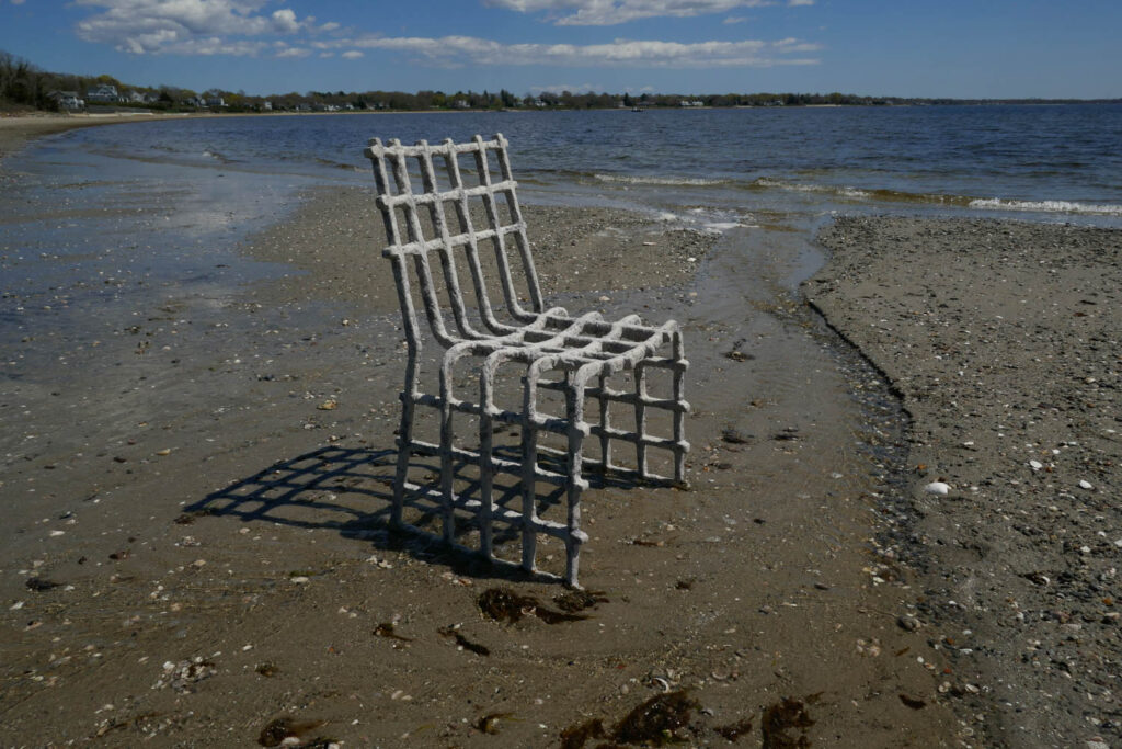 a lattice-style chair on a beach