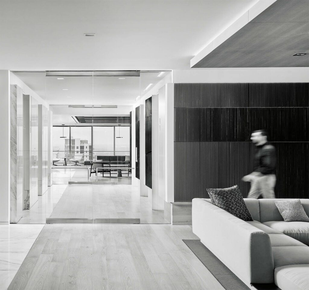 a man walks through the lobby inside Venture Global LNG in Houston