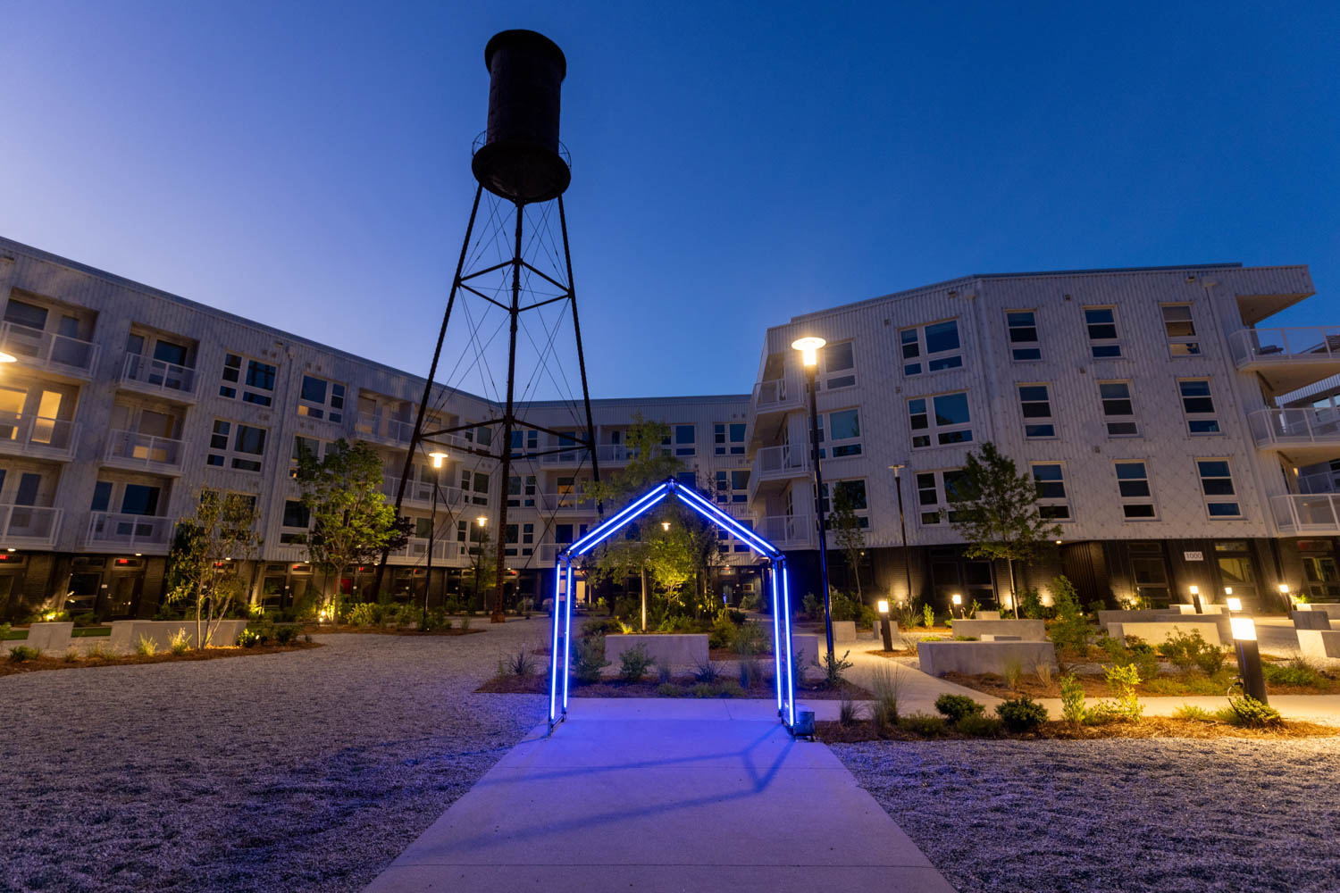 exterior of arts center with high rise buildings and watertower