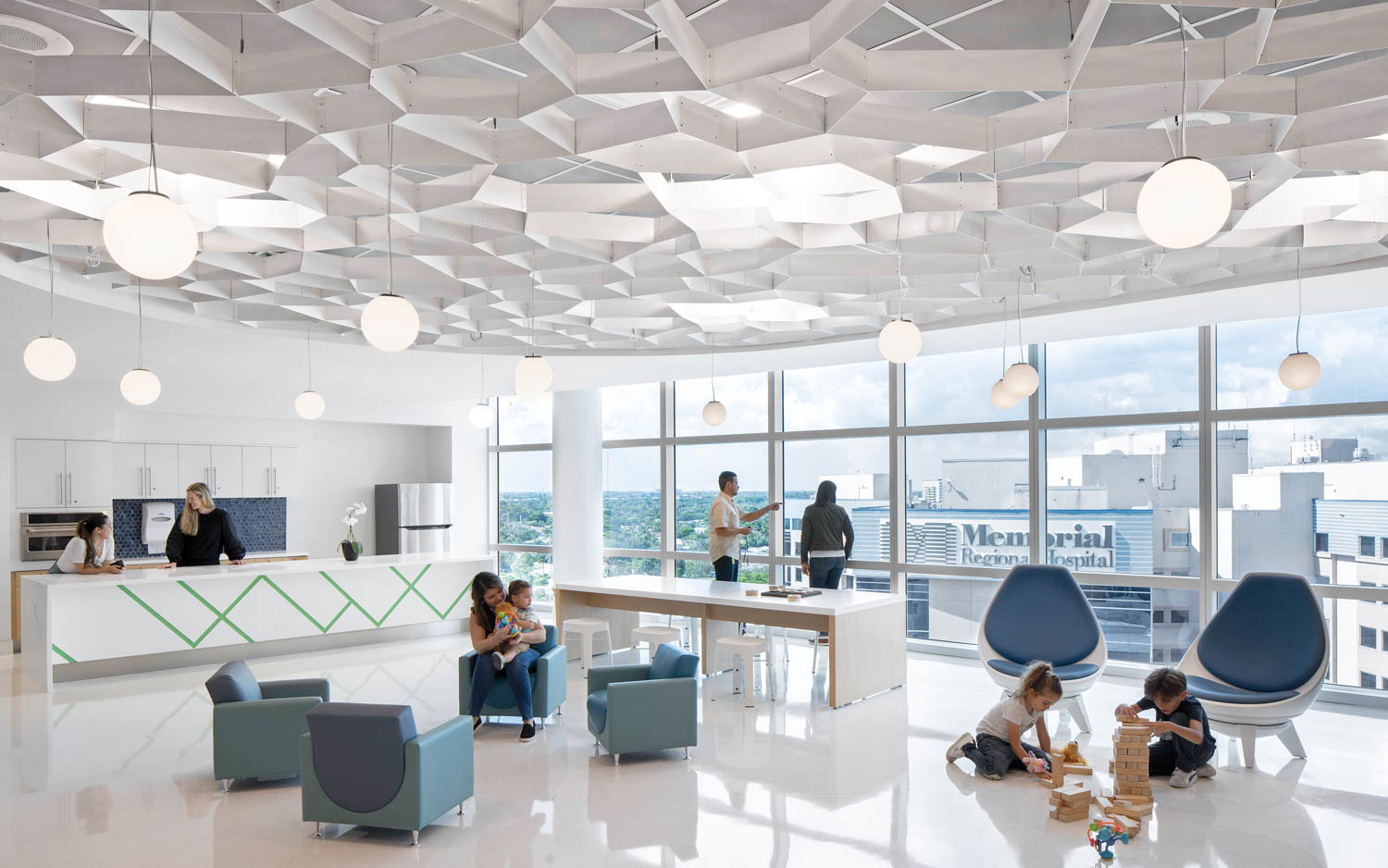 waiting area in hospital with lots of blue chairs