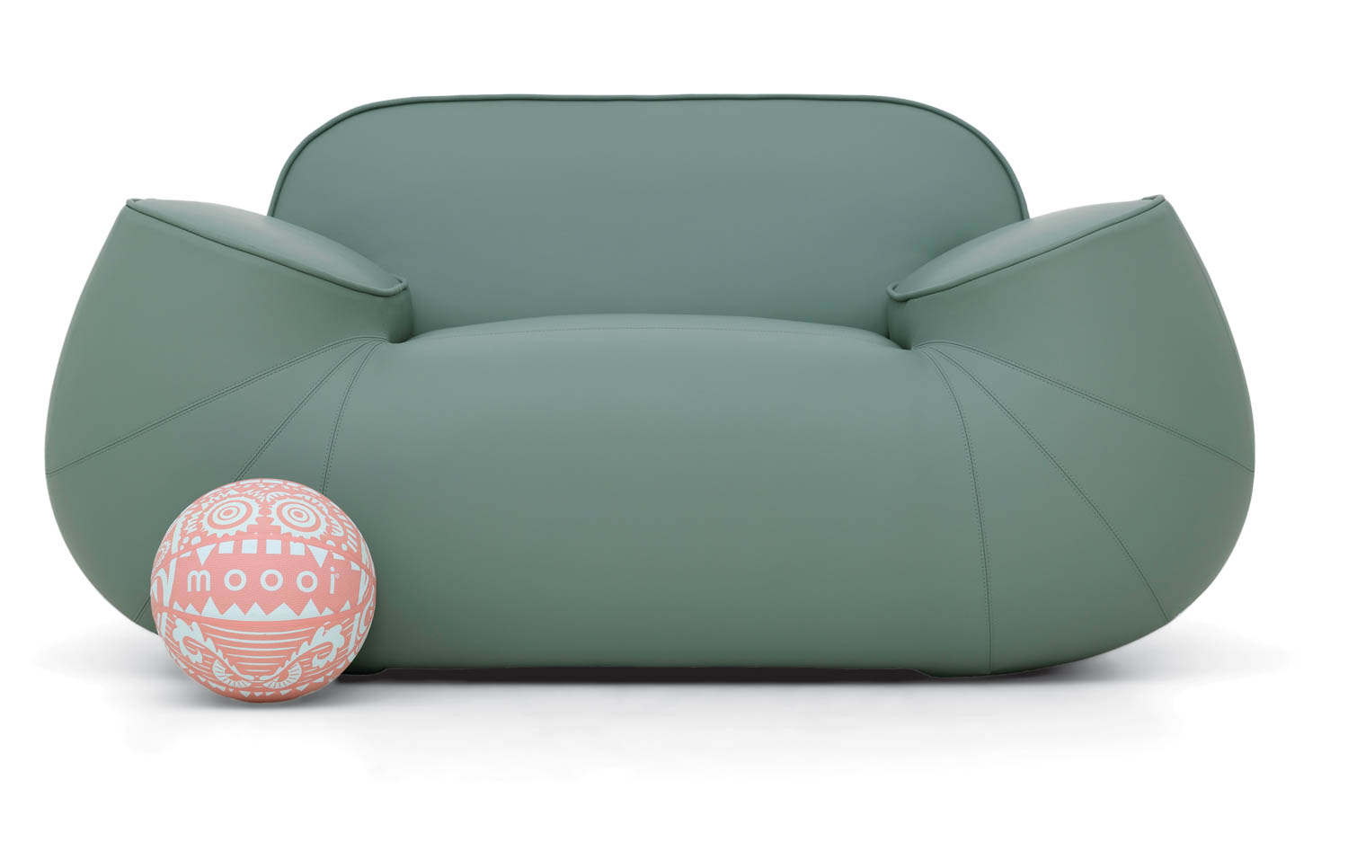 sage green couch with round ball