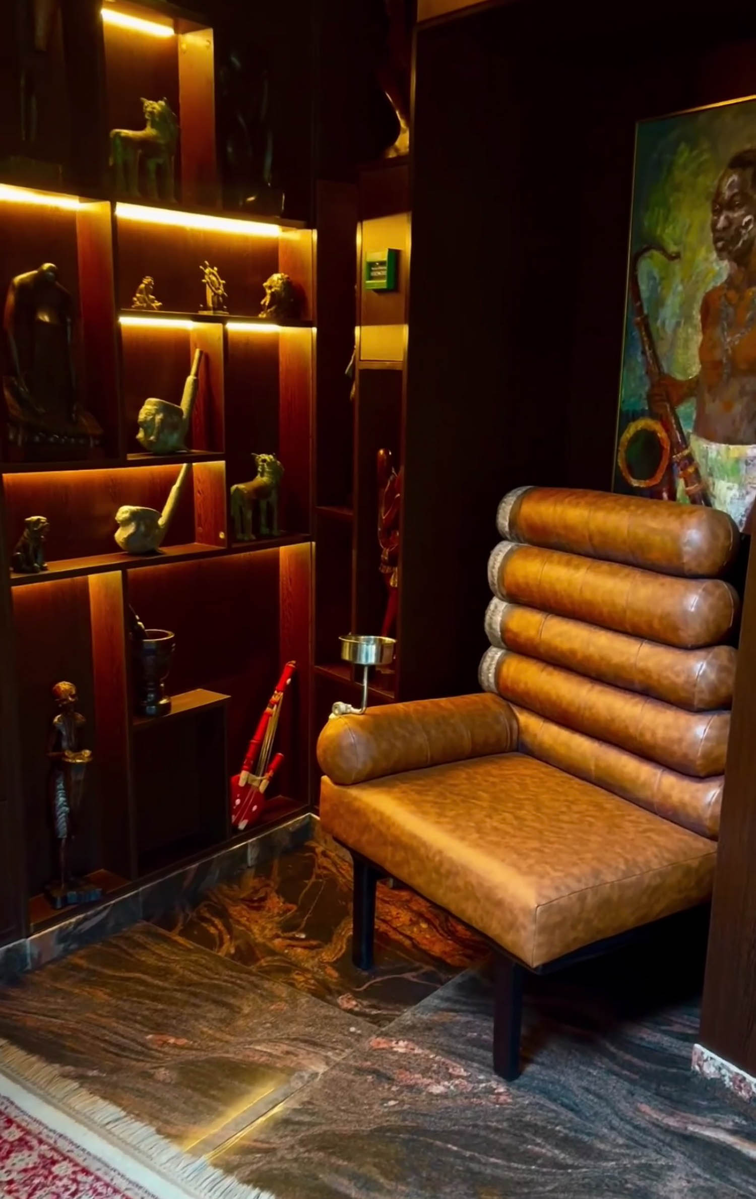 brown chair made of cigarette stubs in a room