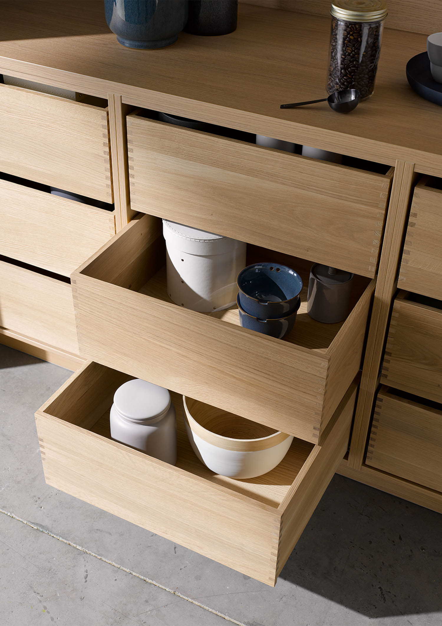 wooden drawers pulled out to reveal bowls inside