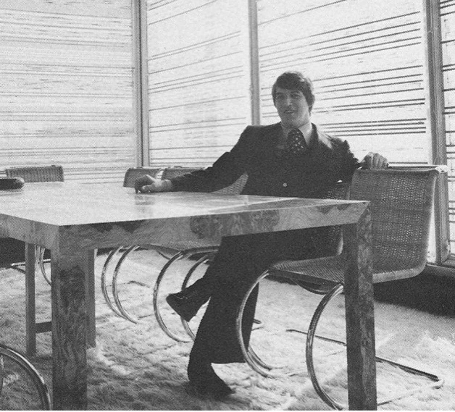 Klaus Nienkämper sitting at a desk by the window