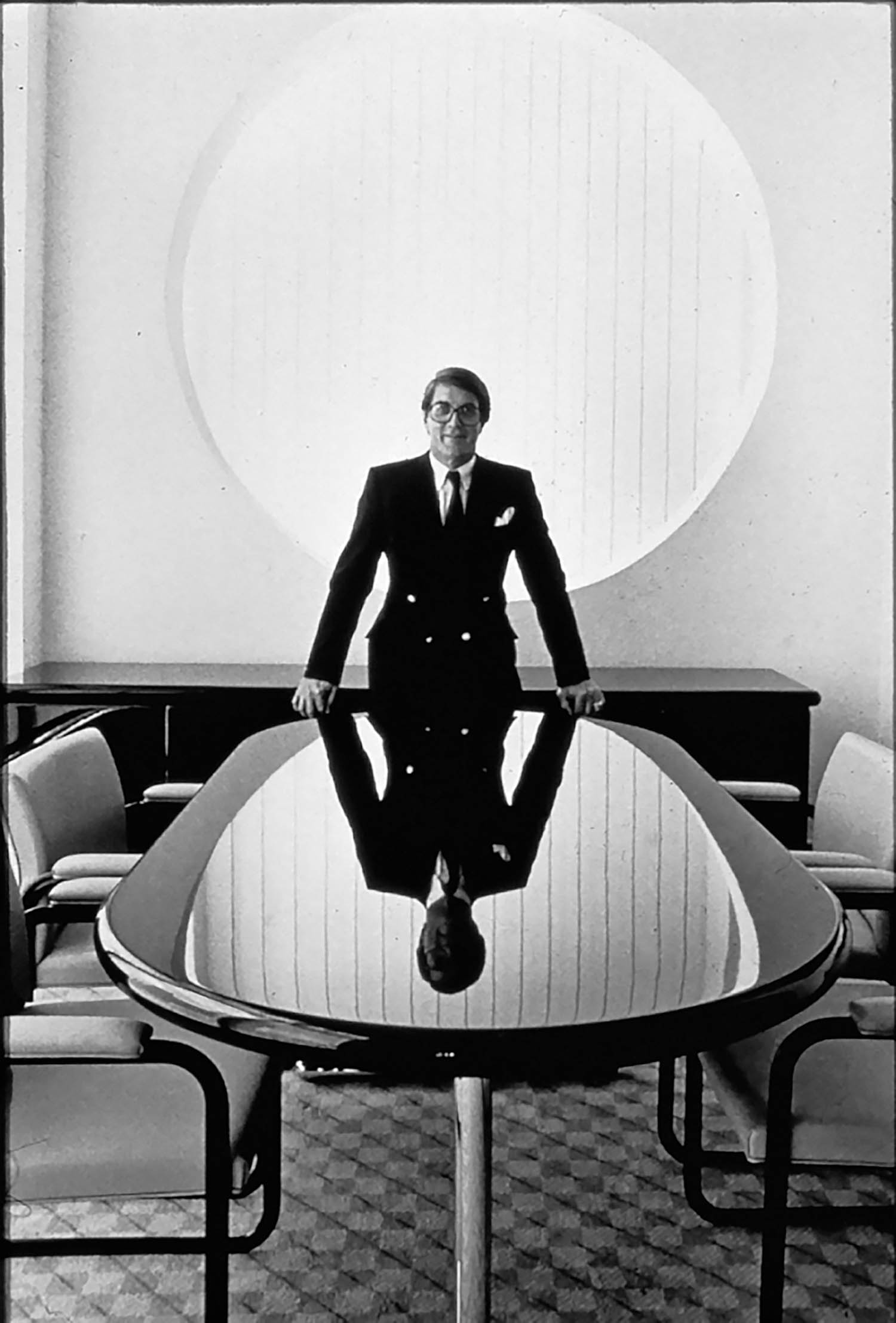 man standing at the head of a conference room