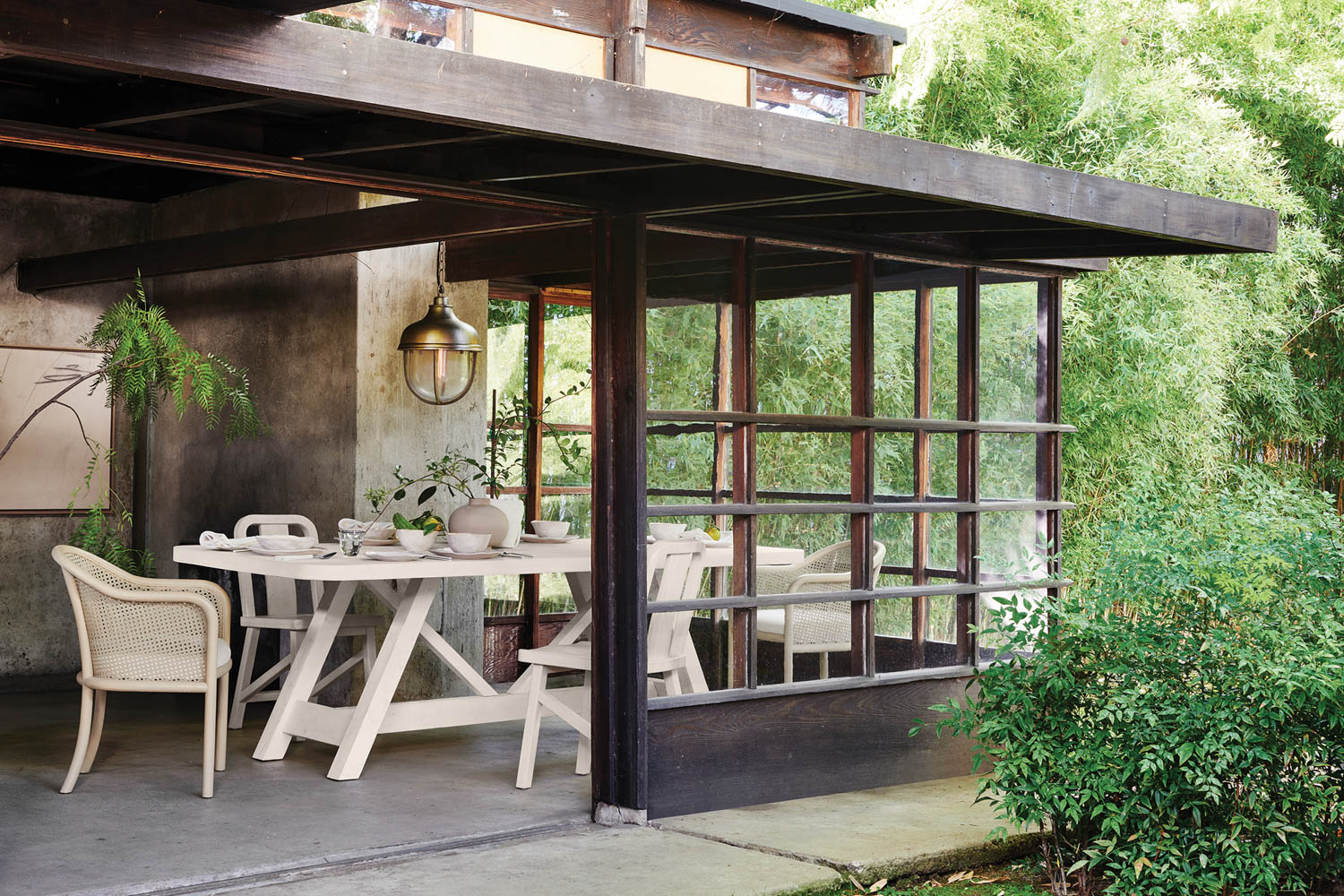 white tables underneath a covered outdoor dining area