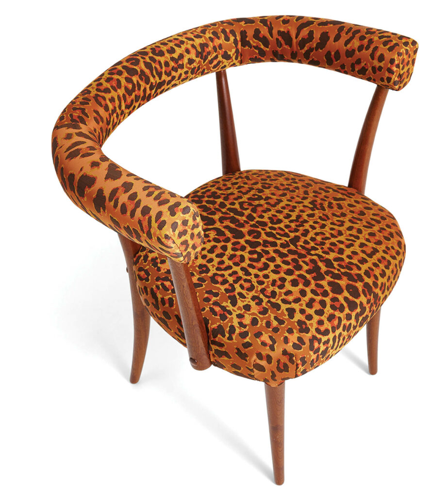 chair covered in leopard spotted fabric