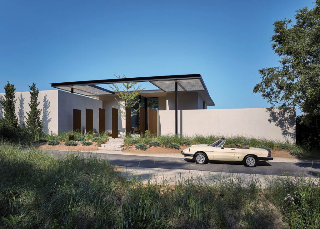 exterior facade of the home with a pergolalike roof extension