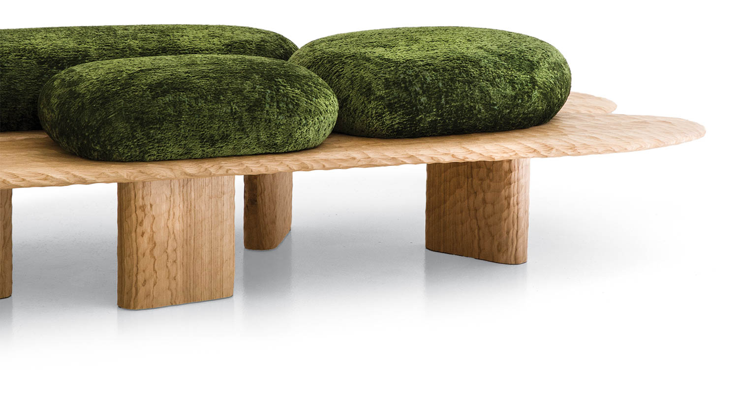 wooden bench with round dark green cushions