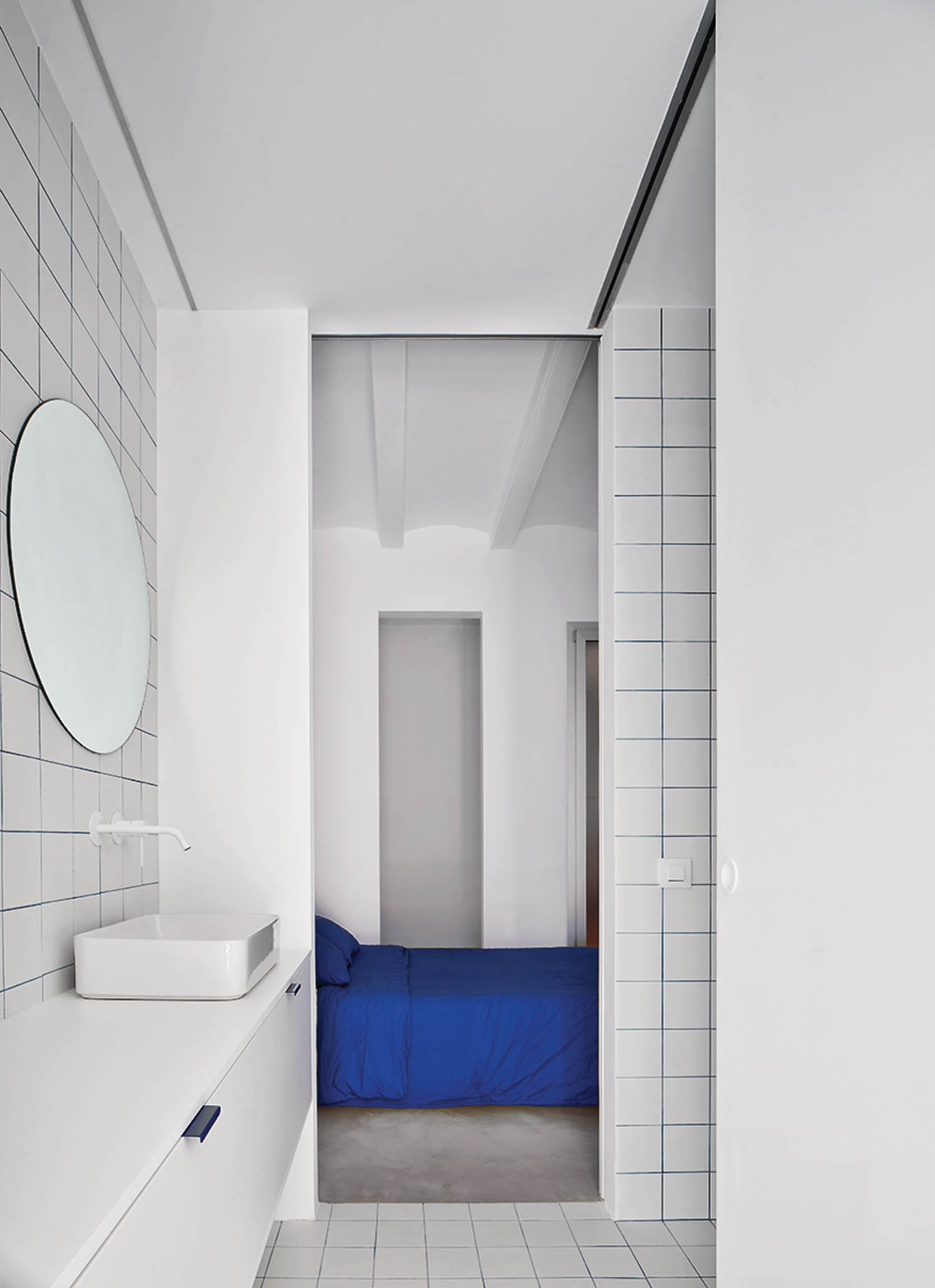 white bathroom with hints of blue