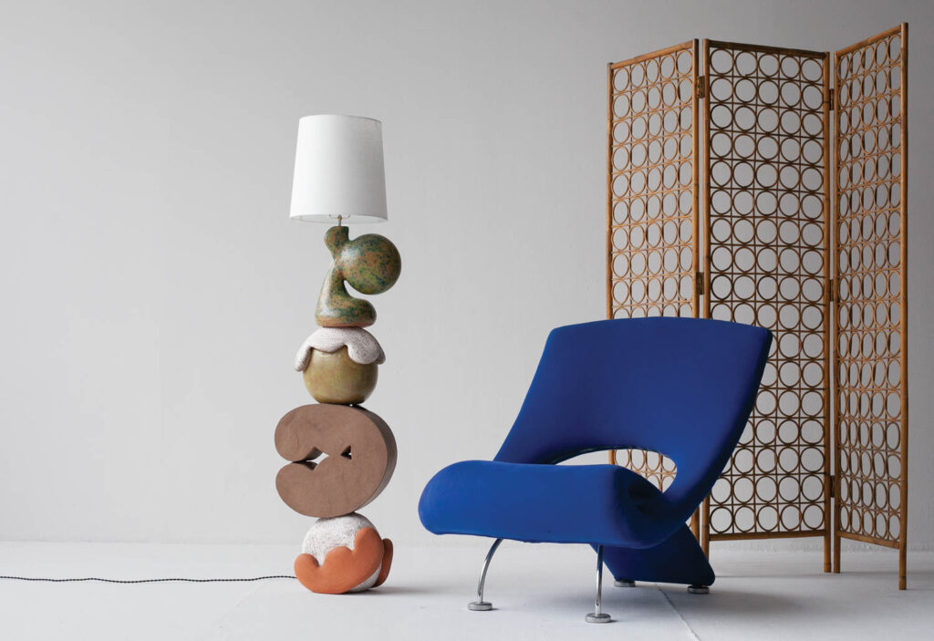 floor lamp next to a blue chair